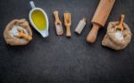 The Ingredients For Homemade Pizza Dough On Dark Stone Backgroun Stock Photo