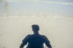 Shadow Man On Beach Stock Photo