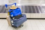 Luggage Near Baggage Band At Airport Stock Photo