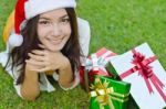 Santa Claus Hat With Red Christmas Gift Box Stock Photo