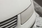 Parked Car Covered With The First Snow In Winter Stock Photo