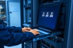 Man Fix Server Network In Data Center Room Stock Photo