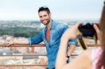 Young Girl Taking Photo Of Her Boyfriend Stock Photo