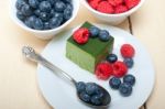 Green Tea Matcha Mousse Cake With Berries Stock Photo