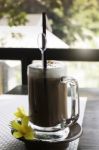 Iced Coffee Latte On Balcony Wooden Table Stock Photo