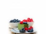 Green Tea Matcha Mousse Cake With Berries Stock Photo