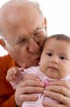 Grandpa Kissing his grandchild Stock Photo