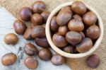 Chestnuts On Wooden Floor Stock Photo