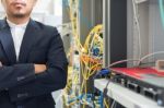 People Fix Core Switch In Network Room Stock Photo