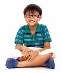 Boy Sitting On Floor Stock Photo