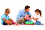 Father Playing With Children Stock Photo