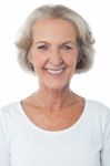 Casual Aged Woman Posing For Camera Stock Photo