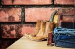 Jeans On A Wooden Table Stock Photo