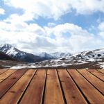 Snow Mountain With Sky And Wood Floor Stock Photo