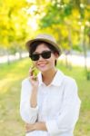 Young Beautiful Woman Wearing Sun Glasses And Fashion Straw Hat Stock Photo