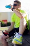 Handsome Young Man Drinking After Running Stock Photo