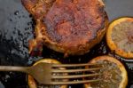 Pork Chop Seared On Iron Skillet Stock Photo