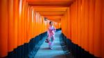 Asian Women In Traditional Japanese Kimonos At Fushimi Inari Shrine In Kyoto, Japan Stock Photo