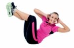 Fit Smiling Woman Doing Crunches Stock Photo