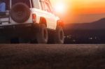 Sport Offroad Vehicle On Dirt Field Against Sun Set Sky For Traveling And Outdoor Lifestyle Stock Photo