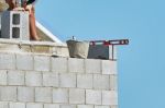 Mason On Laying Bricks Stock Photo