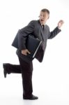 Businessman Running With Briefcase Stock Photo