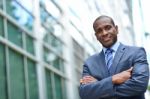 African Business Man Keeping Arms Crossed Stock Photo