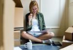 Young Beautiful Woman Moving In New Home Stock Photo