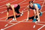 Athletes At Starting Line On Race Track Stock Photo