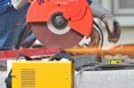 Worker Cutting Steel Tool Stock Photo