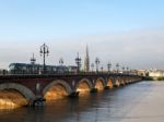 Tram Passing Over The Pont De Pierre Spanning The River Garonne Stock Photo