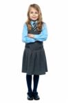 Confident School Girl In Pinafore Uniform Stock Photo