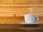 A White Cup Of Coffee On Wood Table Stock Photo