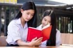 Two Asia Thai High School Student Uniform Best Friends Beautiful Girl Reading Book Stock Photo