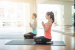 Asian Woman Doing Yoga Indoors Stock Photo