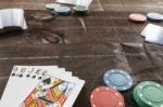 Cards And Poker Chips On Wooden Background Stock Photo