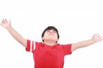 Young Boy Holding Hands Up Stock Photo