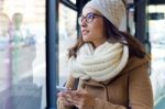 Young Beautiful Woman Using Her Mobile Phone On A  Bus Stock Photo