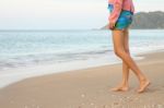 Walking To The Sea In Morning On Beach Stock Photo