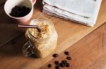 Ice Coffee With Milk And Newspaper On Table Stock Photo