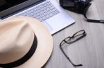 Closeup Of A Wooden Table With Laptop Stock Photo