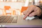 Woman's Hand Using Touch Pad Of Laptop Stock Photo