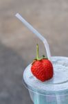 White Drinking Straw And Strawberry Stock Photo