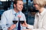 Happy Couple Toasting Red Wine Stock Photo