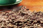 Roasted Coffee Beans And Cups Stock Photo