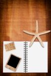 Notebook On Wood With Star Stock Photo