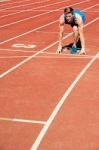 Athletic Man On Track, All Set For Race Stock Photo