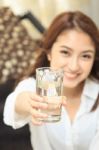 Young Lady Give A Glass Of Water Stock Photo