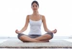 Beautiful Young Woman Doing Yoga Exercises At Home Stock Photo