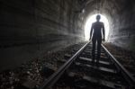 Man In A Tunnel Looking Towards The Light Stock Photo